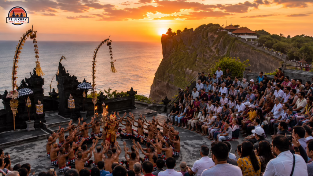 Kecak Dance performance at Uluwatu Temple at sunset with a large audience watching from a cliffside amphitheater